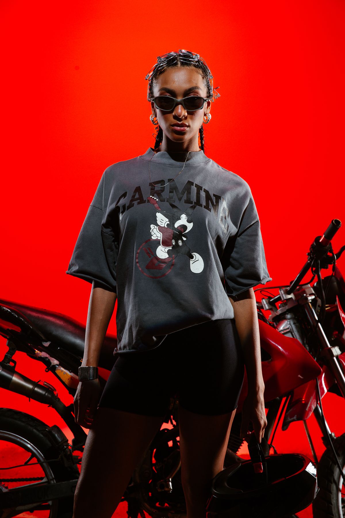 Model in a grey Carmine tee and sunglasses